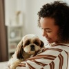 Girl holding her dog